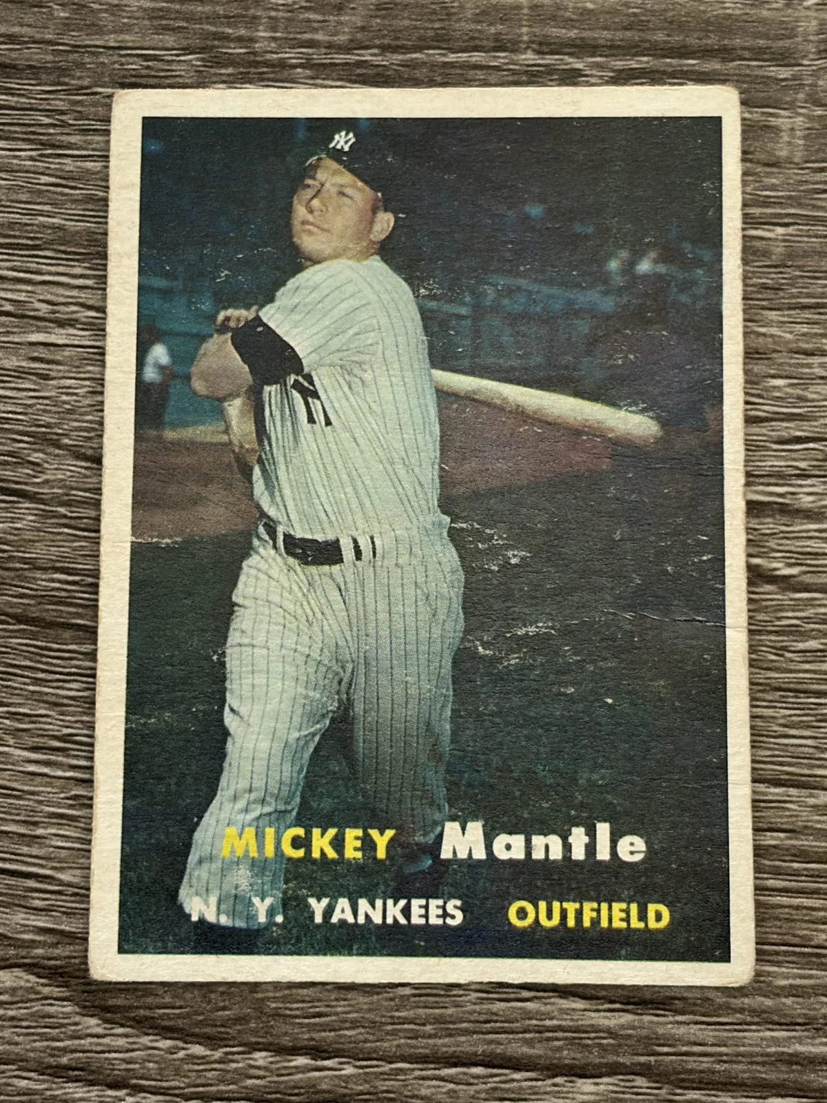 A well-worn 1957 Topps Mickey Mantle #95