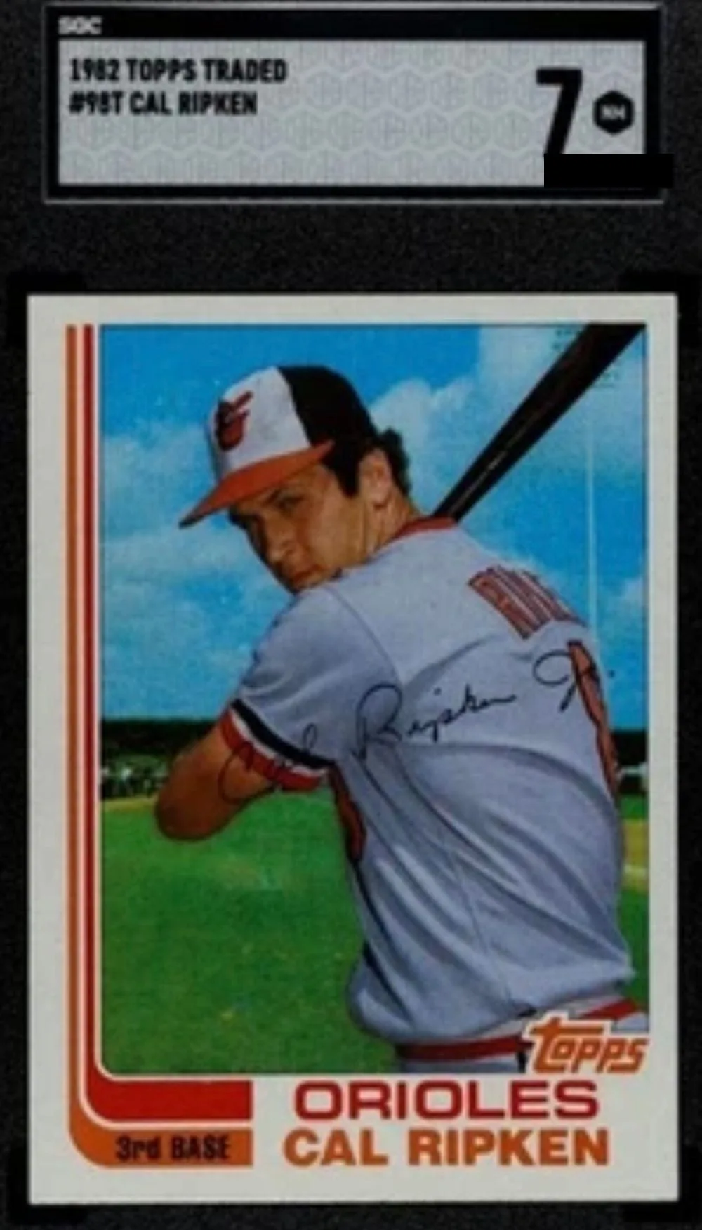 A 1982 Topps Traded Cal Ripken rookie card in an SGC 7 slab